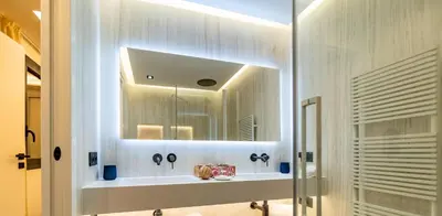 a bathroom with a sink and a mirror at Palm croisette front de mer1 in Cannes