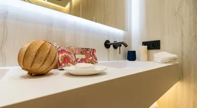 a bathroom with a sink with a bowl on it at Palm croisette front de mer1 in Cannes