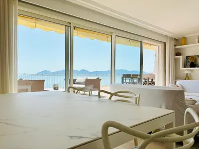a living room with a view of the ocean at Superbe Penthouse avec vue panoramique sur la mer in Cannes