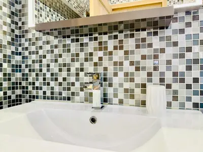 a bathroom with a sink with a faucet at Superbe Villa - Cannes Centre -Proche Palais des Festivals et Plages in Cannes