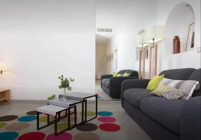 a living room with a couch and a table at La Croisette in Cannes