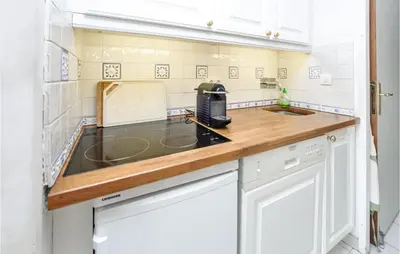 a kitchen with a sink and a counter top at 1 Bedroom Beautiful Apartment In Cannes in Cannes