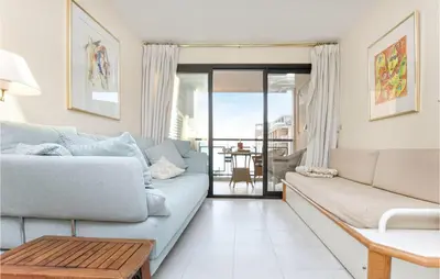 a living room with a couch and a table at 1 Bedroom Beautiful Apartment In Cannes in Cannes