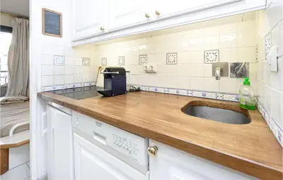 a kitchen with a sink and a counter at 1 Bedroom Beautiful Apartment In Cannes in Cannes