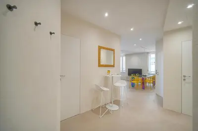 a white room with chairs and a table in it at Moderne 2 chambres, CARRE D'OR- COEUR DE CANNES A2B194 in Cannes