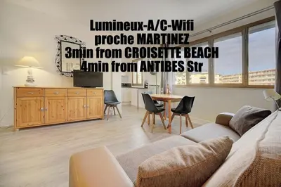 a living room with a couch and a table at Confortable Studio Calme, Latour Mauboug-CARLTON MARTINEZ A0B107 in Cannes