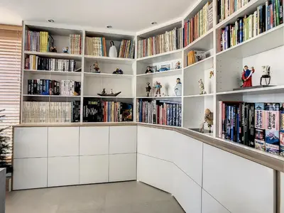 a library with white shelves filled with books at Penthhouse 1 & 2 bedroom apartment 2 mins from the Croisette 335 in Cannes