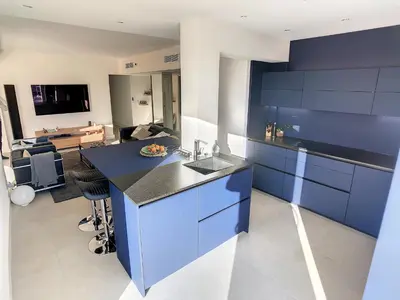 a kitchen with blue cabinets and a blue counter top at Penthhouse 1 & 2 bedroom apartment 2 mins from the Croisette 335 in Cannes