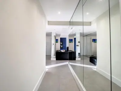 a living room with a glass wall at Penthhouse 1 & 2 bedroom apartment 2 mins from the Croisette 335 in Cannes