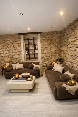 a bedroom with a bed and a stone wall at 