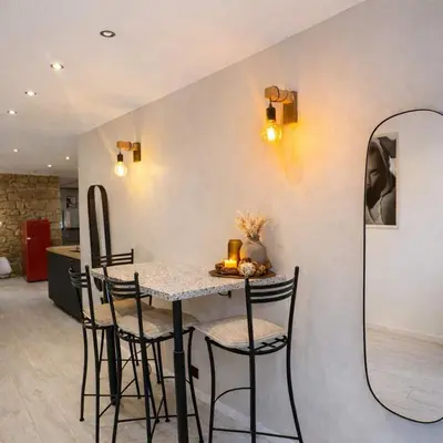 a kitchen with a counter with a stone wall at 
