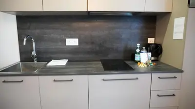 a kitchen with a sink and a counter top at Proche Carlton & Croisette, Appartement 301 - Palmazur Vacances in Cannes