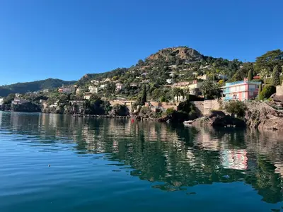 a view of a river with houses on a hill at Appartement 33 m2 comme une junior suite - vue Port et Palais des festivals in Cannes