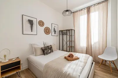 a bedroom with a bed with a towel on it at Résidence Palais des Festivals - Cannes centre in Cannes