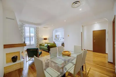 a living room with a glass table and chairs at REF 1320 - Cannes Center - Apartment for rent in Cannes