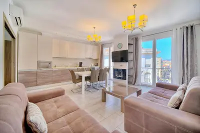 a living room with a couch and a table at REF 1477 - Apartment for rent in Cannes
