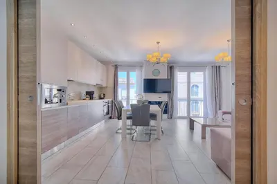 a kitchen with a table and a dining room at REF 1477 - Apartment for rent in Cannes