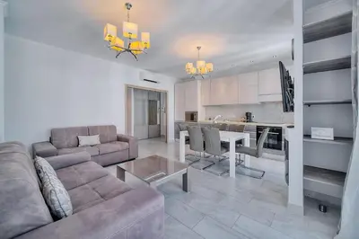 a living room with a couch and a table at REF 1477 - Apartment for rent in Cannes