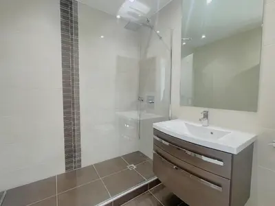 a white bathroom with a sink and a shower at PR Croisette, by Welcome to Cannes in Cannes