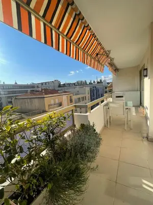 an apartment balcony with a view of a city at PR Croisette, by Welcome to Cannes in Cannes
