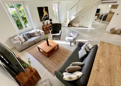 an aerial view of a living room with a couch and chairs at Cannes, mer à 500 m, maison rare in Cannes