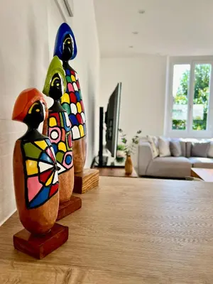 two wooden vases on a table in a living room at Cannes, mer à 500 m, maison rare in Cannes