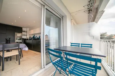 a kitchen and dining room with a table and chairs at Palais Azur in Cannes