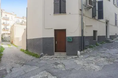 a building with a door on the side of a street at Appartement Palme d'Or - Welkeys in Cannes
