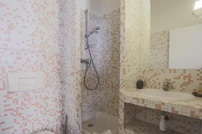 a bathroom with a shower and a sink at Studio Soleil - Welkeys in Cannes