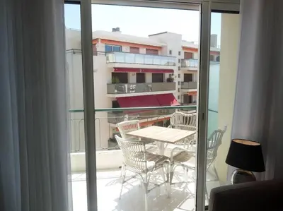 a view of a balcony with a table and chairs at Two bedroom apartment next to the Croisette in Cannes a short walk to the Palais des Festivals - 1961 in Cannes
