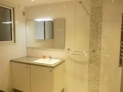 a bathroom with a sink and a shower at Two bedroom apartment next to the Croisette in Cannes a short walk to the Palais des Festivals - 1961 in Cannes