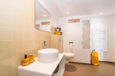 a bathroom with a white sink and a toilet at Le Laeti - 600m plage - Verrière Côte d'Azur in Cannes