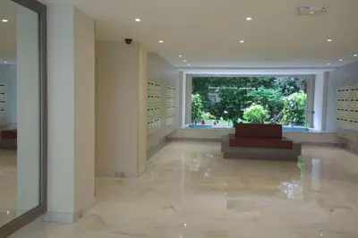 a lobby with a large window in a building at Appartement proche croisette avec parking et climatisation in Cannes