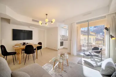 a living room with a couch and a table at Beau 2 chambres TERRASSE, COEUR DU SUQUET-entre Port et Plages A2B238 in Cannes