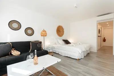 a living room with a couch and a bed at 