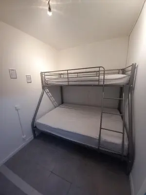 a bunk bed in a small room with at appartement les pieds dans l'eau in Cannes