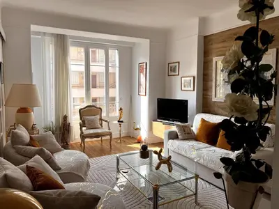 a living room with a couch and a tv at One Bedroom apartment in Cannes Center a few steps from the Croisette and the Martinez Hotel - 2032 in Cannes