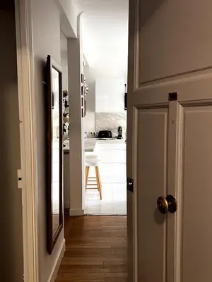 a hallway with a door leading to a kitchen at One Bedroom apartment in Cannes Center a few steps from the Croisette and the Martinez Hotel - 2032 in Cannes