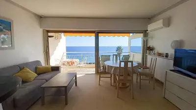 a living room with a couch and a table at Trident A in Cannes
