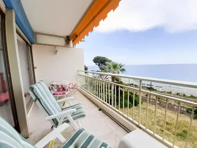 a balcony with chairs and a view of the ocean at Trident A in Cannes
