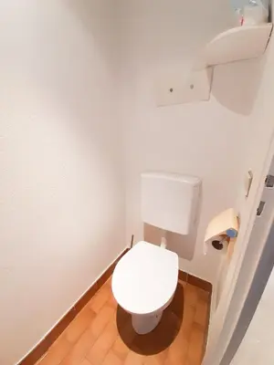 a bathroom with a white toilet in a room at Trident A in Cannes