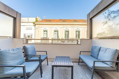 a balcony with two chairs and a table at Superb One bedroom flat and terrace - Cannes center in Cannes