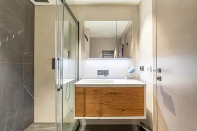 a bathroom with a sink and a glass shower at Superb One bedroom flat and terrace - Cannes center in Cannes