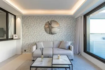 a living room with a couch and a table at Superb One bedroom flat and terrace - Cannes center in Cannes