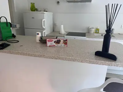 a kitchen with a counter top with a vase on it at Écrin de douceur à 300m de la Croisette Calme in Cannes