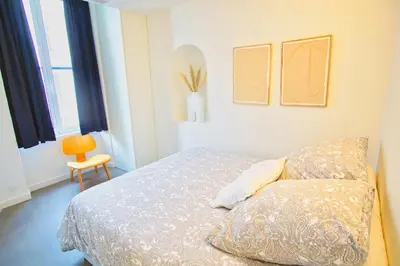 a living room with a couch and a table and chairs at Ref ANTIBES - Palmes d'Or Properties in Cannes