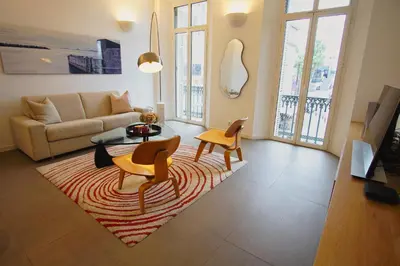 a bedroom with a bed and a chair at Ref ANTIBES - Palmes d'Or Properties in Cannes