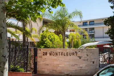 a sign in front of a building with trees at C2 - 2 BDR Montfleury - Pool, Garage, Terrace & AC in Cannes