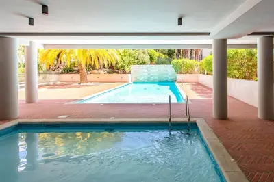 a large swimming pool in a house with a pool at C2 - 2 BDR Montfleury - Pool, Garage, Terrace & AC in Cannes