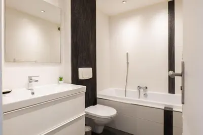 a bathroom with a sink and a toilet and a tub at PANORAMIC SEA VIEW - 2-Br Apartment Mouré Rouge in Cannes